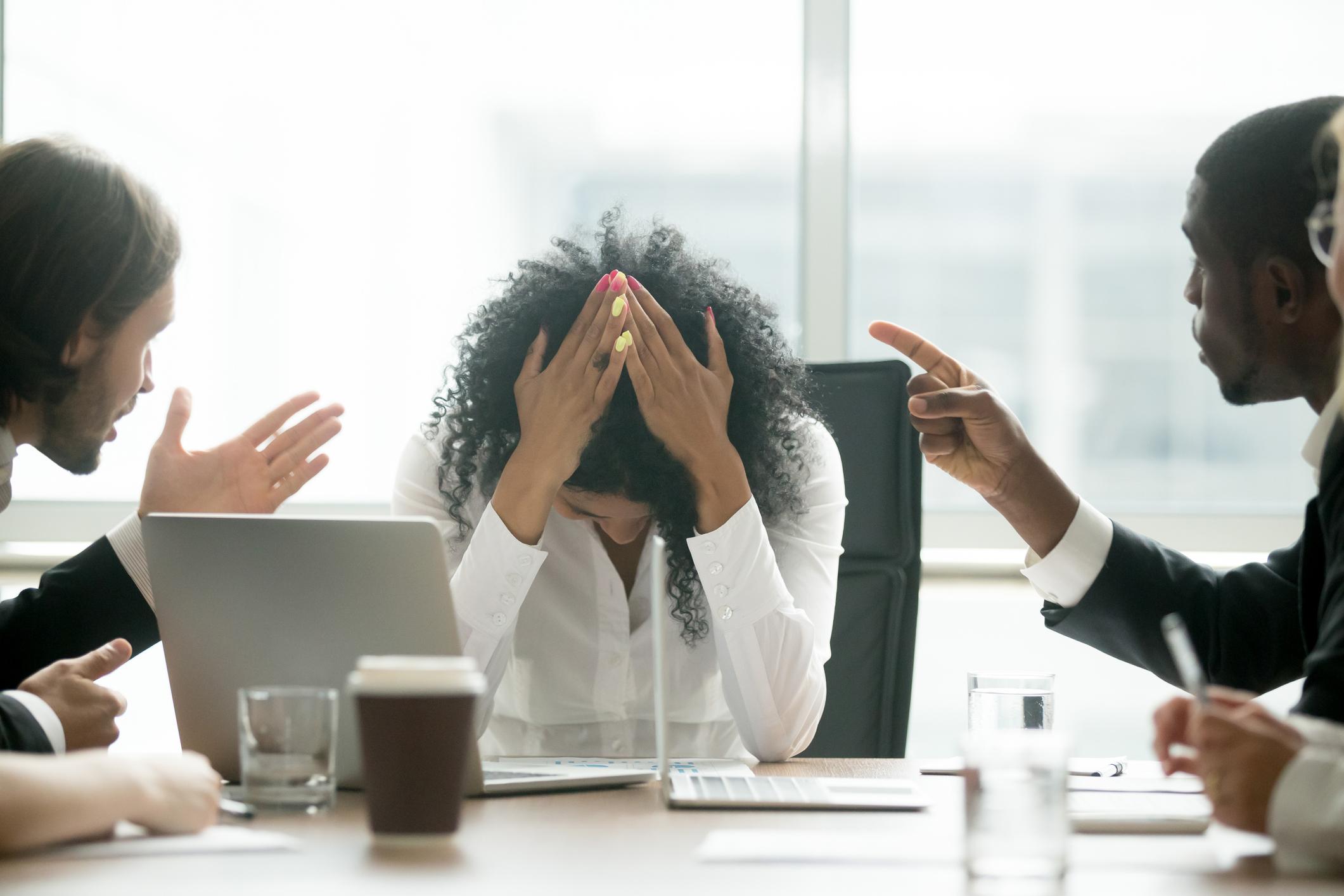 An employee experiencing pressure and isolation in the workplace